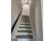 Carpeted stairway features a wooden handrail and leads to the next level of the home at 175 Forest Lake Dr, Fayetteville, GA 30215