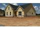 New construction showing bright yellow exterior siding and black roof at 1926 King Mill Rd, Mcdonough, GA 30252