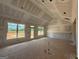 Unfinished living room with large windows offering scenic views and abundant light at 1926 King Mill Rd, Mcdonough, GA 30252