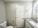 The bathroom features a toilet, vanity with granite countertop, and sleek modern finishes at 2651 Lois Se Ln, Atlanta, GA 30315