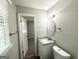 This bathroom features a toilet, vanity with granite countertop, and an exhaust fan at 2651 Lois Se Ln, Atlanta, GA 30315