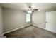 The bedroom features soft carpeting, ceiling fan, and a window at 2651 Lois Se Ln, Atlanta, GA 30315