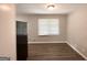 A bright, simple dining area features durable wood floors and a view from a window at 2651 Lois Se Ln, Atlanta, GA 30315