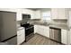 Modern kitchen with stainless steel appliances, granite countertops, and white cabinets at 2651 Lois Se Ln, Atlanta, GA 30315