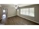 Bright living room features hardwood floors, ceiling fan, and a view of the entry door at 2651 Lois Se Ln, Atlanta, GA 30315