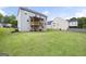 Expansive backyard featuring a covered deck and green lawn at 1016 Buckeye Ln, Villa Rica, GA 30180