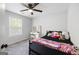 Comfortable bedroom with a ceiling fan, vanity, and neutral decor at 1016 Buckeye Ln, Villa Rica, GA 30180