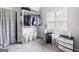 Bedroom closet with custom shelving and organizers, carpet and natural light at 1016 Buckeye Ln, Villa Rica, GA 30180