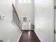 Bright entryway with hardwood floors, a staircase, and a front door with decorative glass at 1016 Buckeye Ln, Villa Rica, GA 30180