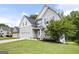 Charming two-story home with a well-manicured lawn and attached garage at 1016 Buckeye Ln, Villa Rica, GA 30180