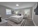 Serene bedroom featuring neutral decor, hardwood floors, and lots of natural light at 1939 Sandringham Sw Dr, Atlanta, GA 30311