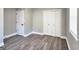 Neutral bedroom with hardwood flooring, white trim, and ample closet space at 1939 Sandringham Sw Dr, Atlanta, GA 30311