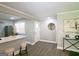Bright and airy living room featuring hardwood floors, a breakfast bar, and updated finishes for modern living at 1939 Sandringham Sw Dr, Atlanta, GA 30311