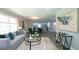 Open-concept living room flowing into the kitchen and dining areas, perfect for entertaining at 1939 Sandringham Sw Dr, Atlanta, GA 30311