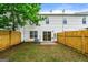 Spacious backyard with new fence and sliding glass door entrance to home at 89 Prospect Path, Hiram, GA 30141