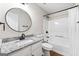 Modern bathroom boasts granite counters, sleek black fixtures and shower at 89 Prospect Path, Hiram, GA 30141