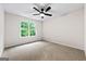 Bright bedroom features neutral carpet, fresh paint, and ceiling fan at 89 Prospect Path, Hiram, GA 30141