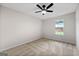 Bedroom with neutral carpet, ceiling fan and bright window view at 89 Prospect Path, Hiram, GA 30141