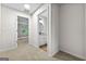 Upstairs hallway leading to a bedroom and a bathroom with updated fixtures at 89 Prospect Path, Hiram, GA 30141