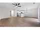 Spacious living area with vinyl floors, a ceiling fan, and open access to the kitchen at 89 Prospect Path, Hiram, GA 30141