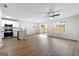 Open-concept layout showcasing the living area with vinyl floors and access to the kitchen at 89 Prospect Path, Hiram, GA 30141