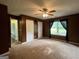Bedroom with a ceiling fan, carpeted floors, and two closets at 150 Doe Run Ct, Sharpsburg, GA 30277