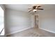 Carpeted bedroom with a ceiling fan at 613 Blackburn Ln, Peachtree City, GA 30269