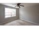 The bedroom has large window and ceiling fan at 613 Blackburn Ln, Peachtree City, GA 30269