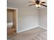 Neutral bedroom with carpeted flooring and ceiling fan at 613 Blackburn Ln, Peachtree City, GA 30269