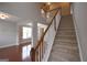 Welcoming entryway features a staircase with wood railing, connecting the home's two stories at 613 Blackburn Ln, Peachtree City, GA 30269