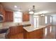 Bright kitchen with granite countertops, stainless appliances, and a large island for food preparation and dining at 613 Blackburn Ln, Peachtree City, GA 30269