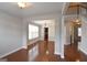 Open living space with hardwood flooring, neutral walls, and an open view to foyer and dining room at 613 Blackburn Ln, Peachtree City, GA 30269