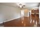 Spacious living area with hardwood floors and views into kitchen area at 613 Blackburn Ln, Peachtree City, GA 30269