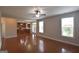 Bright open floor plan connects living area to the kitchen with hardwood floors and natural light at 613 Blackburn Ln, Peachtree City, GA 30269