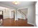 Spacious room featuring hardwood floors, neutral tones, with views into the dining area and foyer at 613 Blackburn Ln, Peachtree City, GA 30269