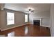 Living room features hardwood floors, white trim, and a cozy fireplace at 613 Blackburn Ln, Peachtree City, GA 30269