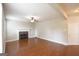 Spacious living area with hardwood floors, fireplace, and a white door at 613 Blackburn Ln, Peachtree City, GA 30269