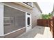 Exterior view of screened in porch with door to yard, offering outdoor living space at 613 Blackburn Ln, Peachtree City, GA 30269