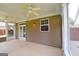 Sunroom features neutral tone walls, concrete floors, windows with screens, and ceiling fans at 613 Blackburn Ln, Peachtree City, GA 30269