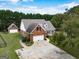 Spacious property with a detached garage and lovely front porch, perfect for outdoor enjoyment at 557 Arrowhead Cir, Rutledge, GA 30663
