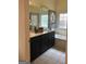 Well-lit bathroom featuring a double vanity and soaking tub beneath a window at 557 Arrowhead Cir, Rutledge, GA 30663