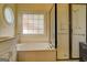 This bathroom features a large tub and a shower with glass doors at 557 Arrowhead Cir, Rutledge, GA 30663