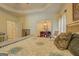 Comfortable bedroom with tray ceilings, en-suite bath, and ample closet space at 557 Arrowhead Cir, Rutledge, GA 30663
