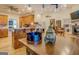 Bright and spacious kitchen flows into the Gathering room, creating an ideal space for entertaining and gathering at 557 Arrowhead Cir, Rutledge, GA 30663