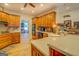 Spacious kitchen features wood cabinetry, modern appliances, and connects to the breakfast area for easy access at 557 Arrowhead Cir, Rutledge, GA 30663