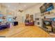 Expansive living room featuring an open floor plan, hardwood floors, and fireplace, creating a versatile living space at 557 Arrowhead Cir, Rutledge, GA 30663