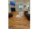 Spacious living room featuring hardwood floors, fireplace, built-ins, and french doors at 557 Arrowhead Cir, Rutledge, GA 30663