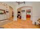 Open-concept living room with hardwood floors and archways, perfect for entertaining at 557 Arrowhead Cir, Rutledge, GA 30663