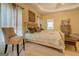 Spacious main bedroom features a large bed, tray ceilings, and carpet at 557 Arrowhead Cir, Rutledge, GA 30663