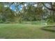 Scenic view of the pond with a dock and seating area for enjoying the outdoors at 557 Arrowhead Cir, Rutledge, GA 30663